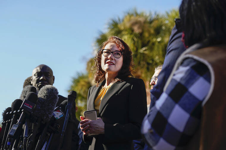 NICOLE CRAINE/THE NEW YORK TIMES / NOV. 24
                                Prosecutor Linda Dunikoski speaks outside the Glynn County Courthouse in Brunswick, Ga., after the jury found three men guilty of murder and other charges for the pursuit and fatal shooting of Ahmaud Arbery. Dunikoski, a prosecutor brought in from the Atlanta area, struck a careful tone in a case that many saw as an obvious act of racial violence.