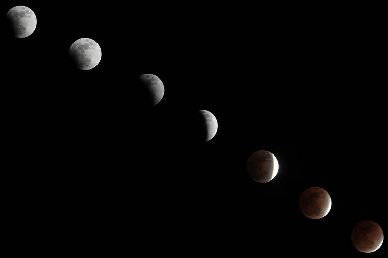 JAMM AQUINO /JAQUINO@STARADVERTISER.COM
                                In this sequence of images taken from 9:14 p.m. to 11:36 p.m., a lunar eclipse is seen in stages over Honolulu on Thursday.