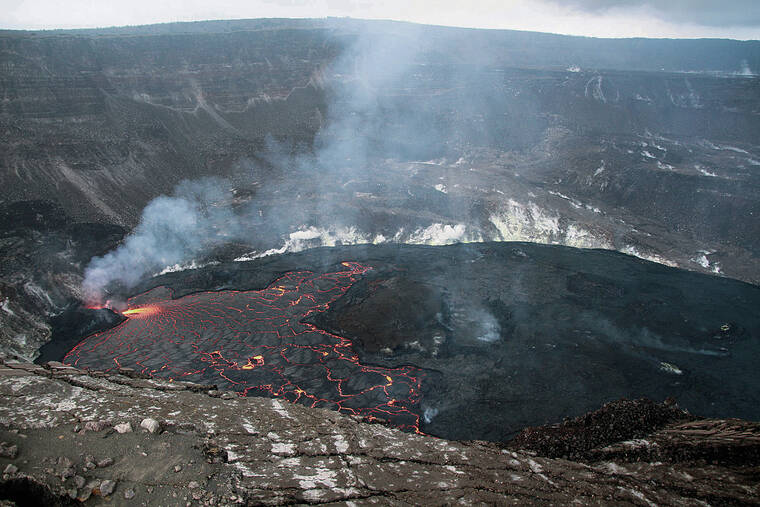 N. DELIGNE / USGS 
                                A wide view of the lava lake in Halemaumau Crater, at the summit of Kilauea, on Friday. This view, looking north, shows the west vent, left, which continues to supply lava to the active portion of the lava lake, while the eastern, right portion is crusted over. The active lake is primarily between the west vent source and the main island, center.