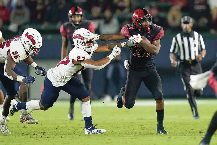 ASSOCIATED PRESS
                                San Diego State running back Greg Bell, right, led the Aztecs with 60 rushing yards in a loss against Fresno State last Saturday.