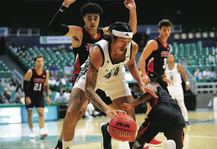 JAMM AQUINO / JAQUINO@STARADVERTISER.COM
                                UH’s 6-foot-10 forward Kamaka Hepa gained control of the ball while being defended by Hawaii Hilo’s 5-8 guard Darren Williams, right, during the fi rst half Wednesday of an Outrigger Rainbow Classic game at SimpliFi Arena at the Stan Sheriff Center.