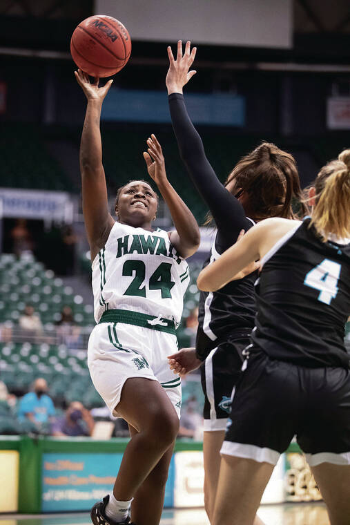 GEORGE F. LEE / GLEE@STARADVERTISER.COM 
                                UH’s Nae Nae Calhoun went up for a shot against Hawaii Pacific on Wednesday.