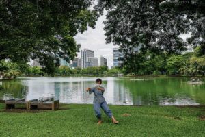 ASSOCIATED PRESS / JUNE 26
                                It’s important for heart patients to continue exercising for heart health and mental health. Above, a masked woman practices tai chi in a relaxing green space in Bangkok.