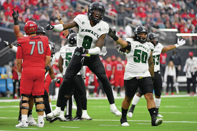 ASSOCIATED PRESS
                                Hawaii defensive back Eugene Ford (8) reacts after Hawaii recovered a fumble by UNLV during the first half of Saturday’s game.