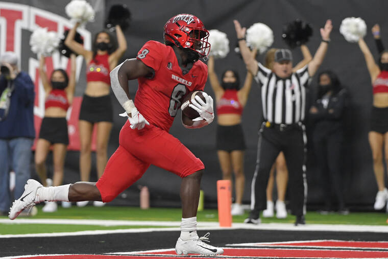 ASSOCIATED PRESS
                                UNLV running back Charles Williams runs into the end zone for a touchdown against Hawaii during the second half.