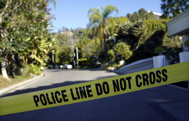ASSOCIATED PRESS
                                Police tape blocks the intersection of Maytor Place and Barrie Drive in the Trousdale Estates section of Beverly Hills, Calif. Jacqueline Avant, the wife of music legend Clarence Avant, was fatally shot in the neighborhood early Wednesday.