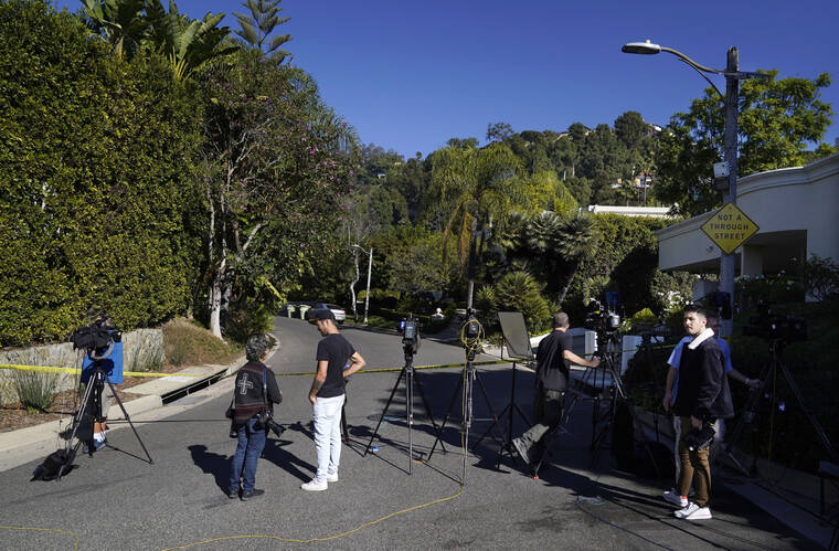 ASSOCIATED PRESS
                                Media gather at the intersection of Maytor Place and Barrie Drive in the Trousdale Estates section of Beverly Hills, Calif.. Jacqueline Avant, the wife of music legend Clarence Avant, was fatally shot in the neighborhood early Wednesday.