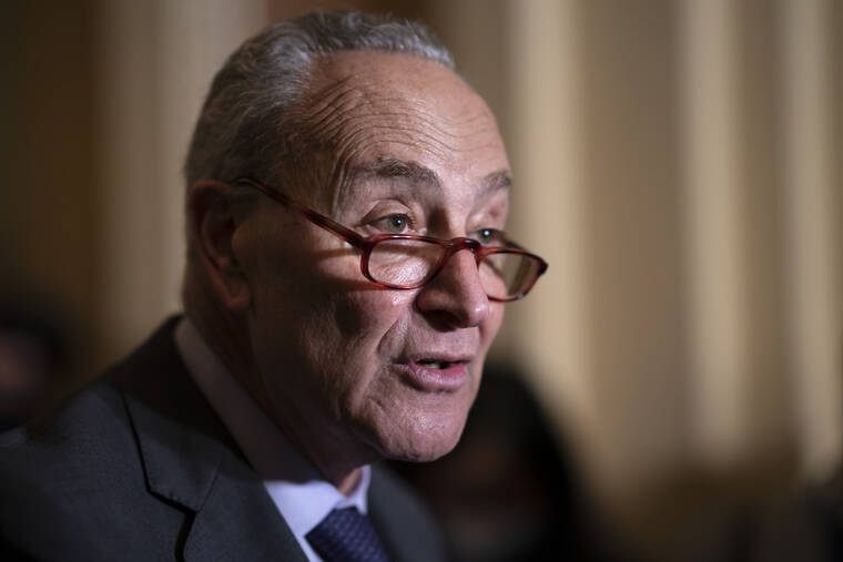 ASSOCIATED PRESS
                                Senate Majority Leader Chuck Schumer, D-N.Y., speaks to reporters after a Democratic policy meeting at the Capitol in Washington.