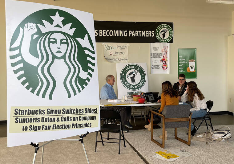 ASSOCIATED PRESS
                                Richard Bensinger, left, who is advising unionization efforts, along with baristas Casey Moore, right, Brian Murray, second from left, and Jaz Brisack, second from right, discussed their efforts to unionize three Buffalo-area stores, inside the movement’s headquarters, Oct. 28, in Buffalo, N.Y. Starbucks is fighting an expanded effort to unionize its stores.