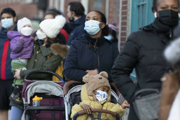 ASSOCIATED PRESS / DEC. 5
                                Makda Yesuf, center, and her son Jaden wait in line at a COVID-19 walk-in testing site in Cambridge, Mass. Even as the U.S. reaches a COVID-19 milestone of roughly 200 million fully-vaccinated people, infections and hospitalizations are spiking, including in highly-vaccinated pockets of the country like New England.