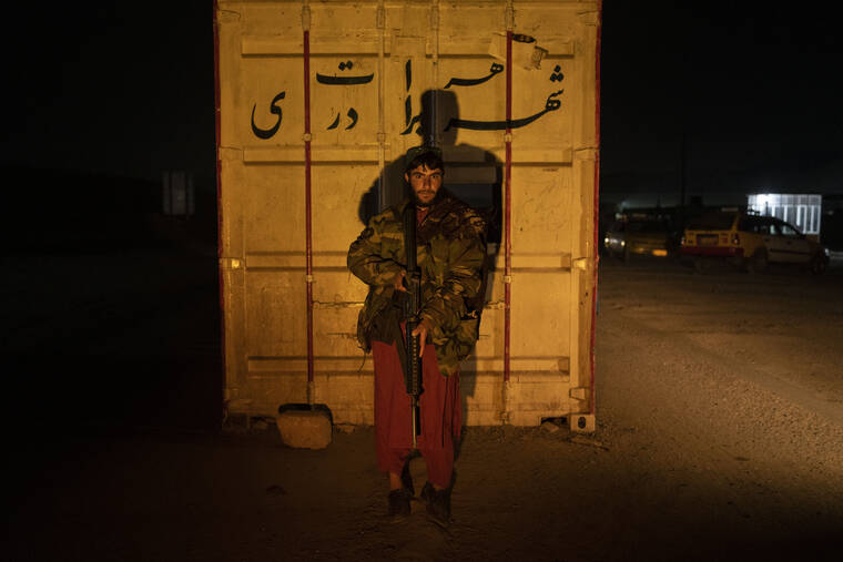 ASSOCIATED PRESS / NOV. 27
                                A Taliban fighter poses for a photo at a check point in Herat Afghanistan. Since the Taliban’s takeover of Afghanistan just over three months ago amid a chaotic withdrawal of U.S. and NATO troops, its fighters have changed roles, turning from fighting in the mountains and the fields to running the country.