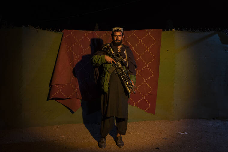 ASSOCIATED PRESS / NOV. 29
                                A Taliban fighter poses for a photo at a check point in Herat Afghanistan. Since the Taliban’s takeover of Afghanistan just over three months ago amid a chaotic withdrawal of U.S. and NATO troops, its fighters have changed roles, turning from fighting in the mountains and the fields to running the country.