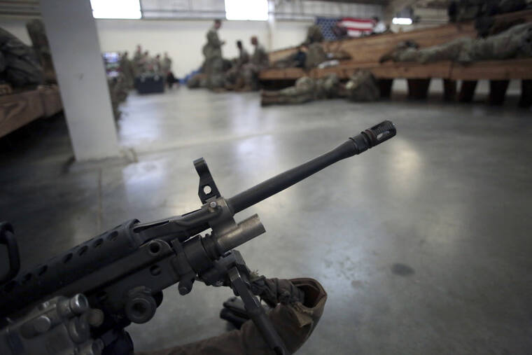 ASSOCIATED PRESS
                                A U.S. Army soldier’s weapon was shown, in January 2020, at Fort Bragg, North Carolina. Two men who forged deep bonds of friendship while serving in the Army in Afghanistan would be arrested in 2018 for a scheme to steal weapons and explosives from an armory at Fort Bragg, North Carolina, and sell them.