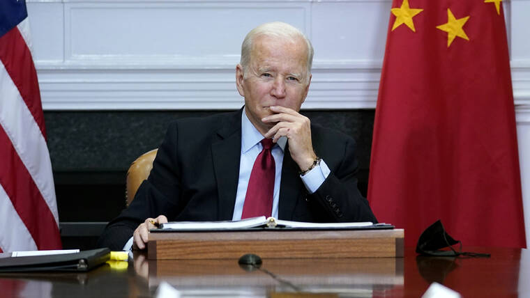 SUSAN WALSH / AP
                                President Joe Biden listens as he meets virtually with Chinese President Xi Jinping from the Roosevelt Room of the White House in Washington, Nov. 15, 2021.