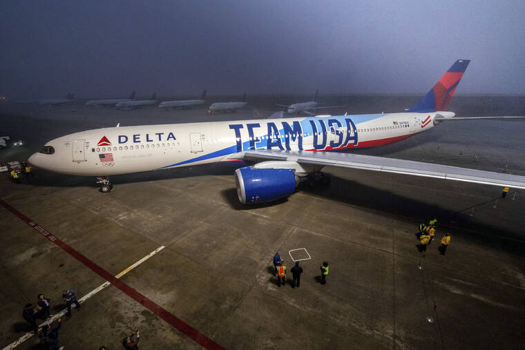 ASSOCIATED PRESS
                                In this photo provided by Delta Air Lines, Delta Air Lines unveils its custom Team USA aircraft livery today at Delta TechOps facilities in Atlanta.