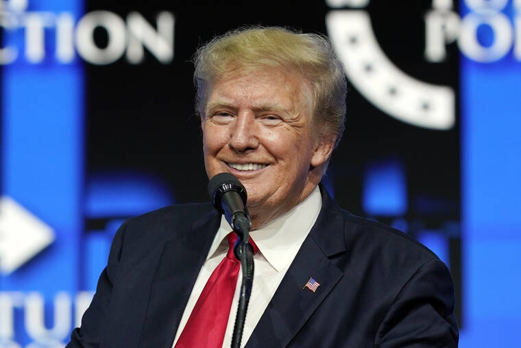 ASSOCIATED PRESS
                                Former President Donald Trump smiled as he paused while speaking to supporters, July 24, at a Turning Point Action gathering in Phoenix. Trump revealed he received a booster shot of the COVID-19 vaccine, drawing boos from a crowd in Dallas.