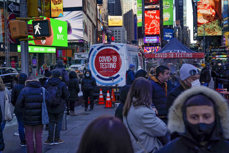 ASSOCIATED PRESS
                                People waited in a long line to get tested for COVID-19 in Times Square, New York, today. Just a couple of weeks ago, New York City seemed like a relative bright spot in the U.S. coronavirus struggle.