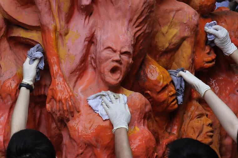 ASSOCIATED PRESS
                                University students cleaned the “Pillar of Shame” statue, a memorial for those killed in the 1989 Tiananmen crackdown, at the University of Hong Kong, in June 2019. The 26-foot-tall Pillar of Shame, which depicts 50 torn and twisted bodies piled on top of each other, was made by Danish sculptor Jens Galschioet to symbolize the lives lost during the military crackdown on pro-democracy protesters in Beijing’s Tiananmen Square on June 4, 1989.