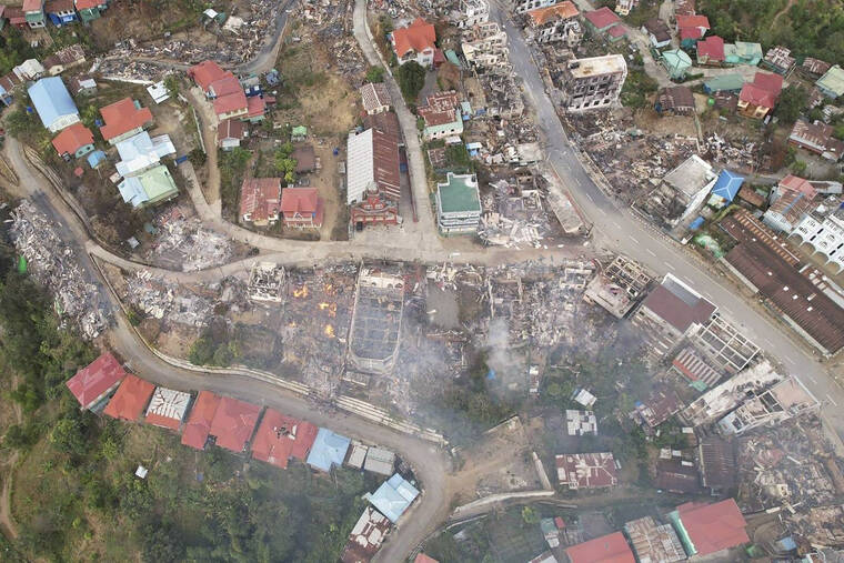 CHIN HUMAN RIGHTS ORGANIZATION VIA ASSOCIATED PRESS
                                In this aerial photo, fires destroyed numerous buildings in the town of Thantlang in Chin State in northwest Myanmar, on Dec. 4. More than 580 buildings have been burned since September, according to satellite image analysis by Maxar Technologies.