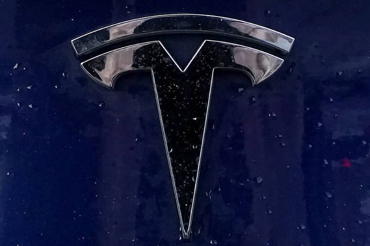 ASSOCIATED PRESS
                                A Tesla electric vehicle emblem was affixed to a passenger vehicle, Feb. 21, in Boston. Tesla is recalling certain Model 3s, today, because a coaxial cable for its backup camera can become worn and fail to transmit to the driver’s main console.