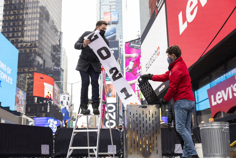 ASSOCIATED PRESS
                                Jonathan Bennett, host of Good Riddance Day, left, and Joe Papa, Director of Events, Times Square Alliance burned a 2021 banner at the official Good Riddance Day celebration in Times Square, Tuesday, in New York.