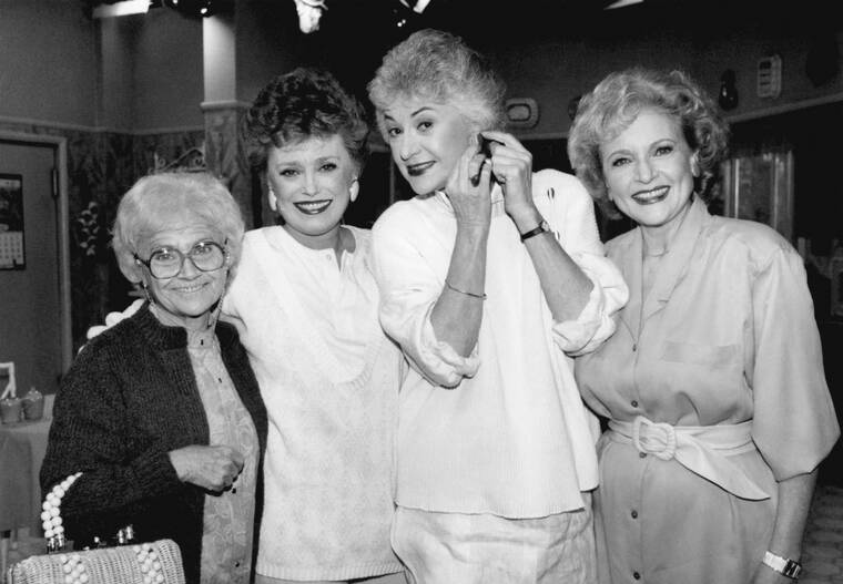 ASSOCIATED PRESS / DEC. 25, 1985
                                Actors from the television series “The Golden Girls” stand together during a break in taping in Hollywood. From left are, Estelle Getty, Rue McClanahan, Bea Arthur and Betty White. White, a television mainstay for more than 60 years, has died. She was 99.