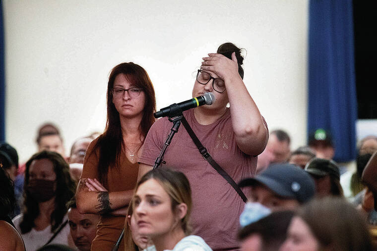 GEORGE F. LEE / GLEE@STARADVERTISER.COM
                                Military personnel and their families continued to voice their discontent at Wednesday’s town hall meeting at the Aliamanu Military Reservation Chapel regarding possible contamination of the Navy’s water system.