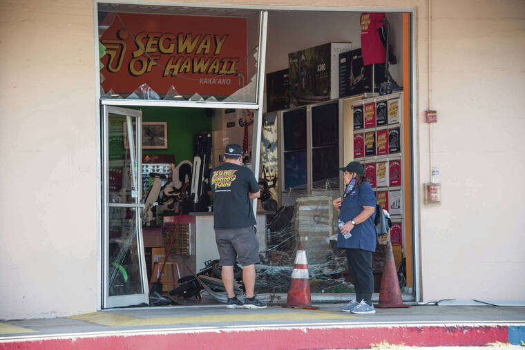 CRAIG T. KOJIMA / CKOJIMA@STARADVERTISER.COM
                                Thieves reversed their pickup truck into the storefront of Segway of Hawaii in Kakaako on Thursday, taking four electric bikes and assaulting a security guard.