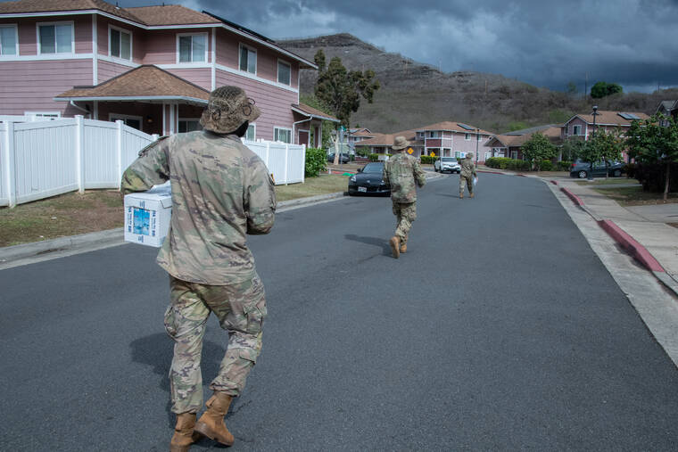 CRAIG T. KOJIMA / CKOJIMA@STARADVERTISER.COM
                                U.S. Army soldiers went door-to-door delivering water to residents of Aliamanu Military Reservation and Red Hill on Saturday.