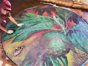 COURTESY KAREN LUCAS
                                Karen Lucas works on her mosaic at the Ho‘opili rail station.