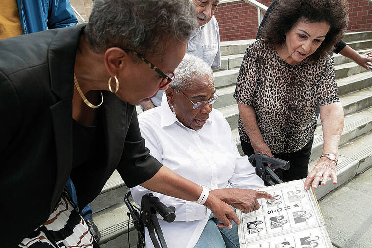 PHILADELPHIA INQUIRER / TNS PHOTO
                                A. Dolores Rozier, center, looks through her 1960 Camden High School yearbook along with Delia Ford Brown, left, Ron Venella and Dolores Firth Bailey.