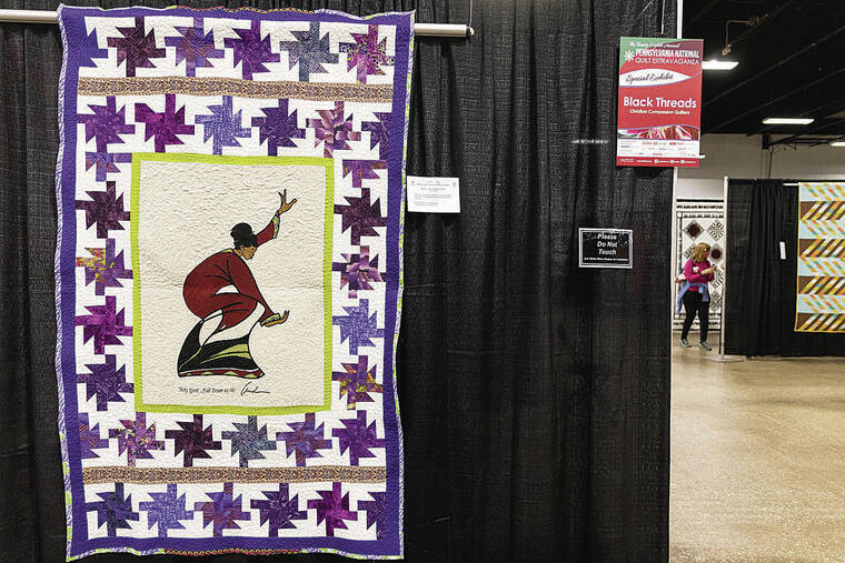 PHILADELPHIA INQUIRER / TNS
                                “Rejoice,” a quilt by Joye Hollingshed, hand-pieced by Alice Hollingshed, and machine-quilted by Sheila Colson, was showcased in the “Black Threads” exhibit at the Pennsylvania National Quilt Extravaganza. The three women are members of the Compassionate Christian Quilters in West Philadelphia.