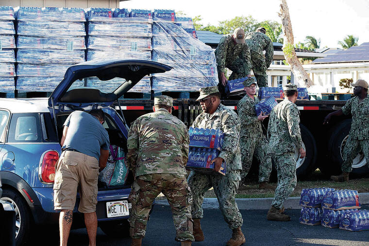 GEORGE F. LEE / GLEE@STARADVERTISER.COM
                                The Navy says that it first started receiving complaints about a chemical or fuel smell in tap water from residents on Nov. 28 and that it shut down its Red Hill shaft that evening. Navy personnel at Halsey Terrace Community Center distribute bottled water to affected families in base housing.