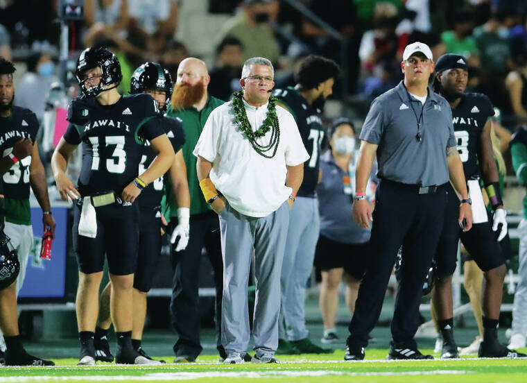 JAMM AQUINO / NOV. 20
                                Hawaii head coach Todd Graham, middle, looked on from the sideline during the first half of a game against Colorado State at Ching Complex.