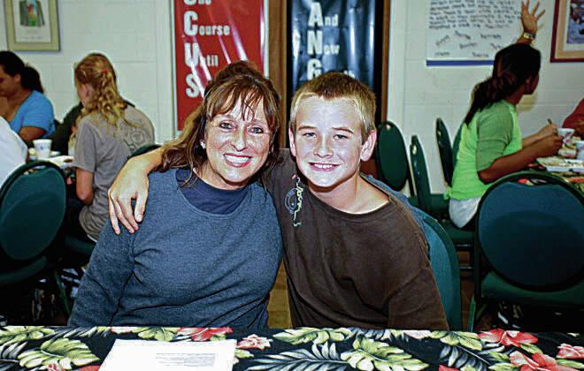 COURTESY WINNERS’ CAMP
                                Delorese Gregoire, left, used the feelings she had as a foster child to create the Winners’ Camp Foundation. She is pictured with Caden Smith.