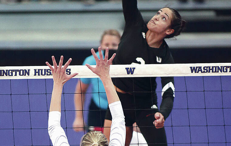 ANTHONY BOLANTE / SPECIAL TO THE STAR-ADVERTISER
                                UH’s Brooke Van Sickle spiked the ball against Washington on Saturday. Van Sickle was named to the AVCA All-Pacific North Region team.