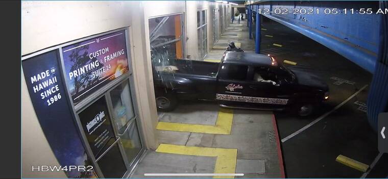 COURTESY JEANNE DATZ-RICE
                                A screenshot from surveillance footage shows a black pickup truck reversed into the Segway of Hawaii storefront at the Coral Commercial Center in Kakaako.