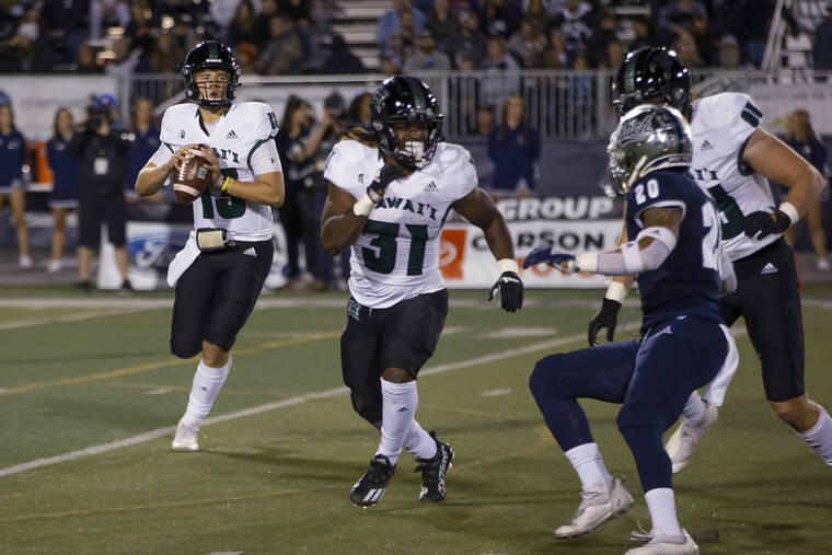 ASSOCIATED PRESS
                                Hawaii quarterback Brayden Schager rolled out against Nevada in the first half of a game in Reno, Nev., on Oct. 16.