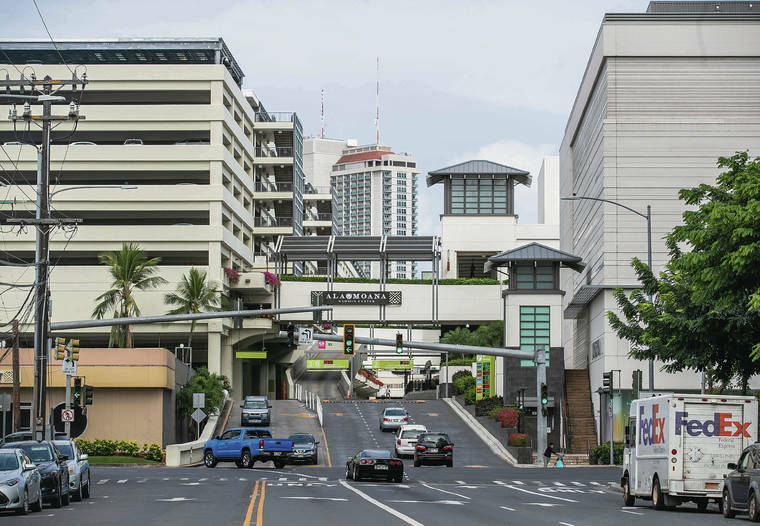 CINDY ELLEN RUSSELL / MAY 2020
                                Cars are seen entering and exiting Ala Moana Center.