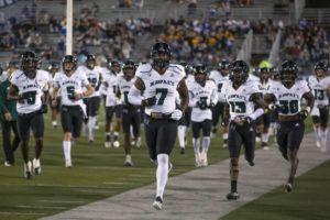 ASSOCIATED PRESS
                                The Hawaii team takes the field before an NCAA college football game against Nevada in Reno, Nev., Oct. 16, 2021.