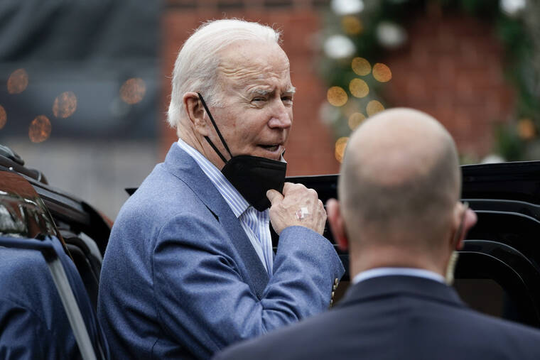 ASSOCIATED PRESS
                                President Joe Biden speaks to members of the media as gets into his motorcade after having New Year’s Eve lunch with first lady Jill Biden at Banks’ Seafood Kitchen in Wilmington, Del., on Dec. 31.