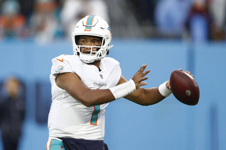 ASSOCIATED PRESS
                                Miami Dolphins quarterback Tua Tagovailoa passes against the Tennessee Titans in the first half of an NFL football game today in Nashville, Tenn.