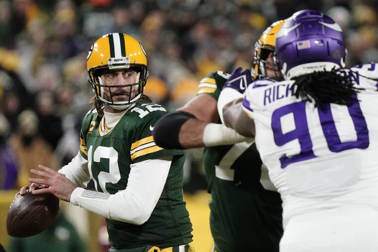 ASSOCIATED PRESS
                                Green Bay Packers’ Aaron Rodgers threw during the first half of a game against the Minnesota Vikings Sunday, in Green Bay, Wis.