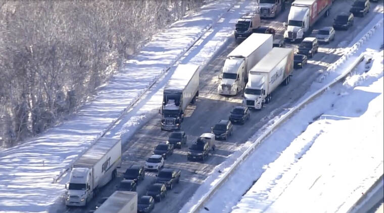 WJLA VIA ASSOCIATED PRESS
                                Motorists sat stranded on Interstate 95 in Northern, Va., today. Hundreds of motorists were stranded all night in snow and freezing temperatures along a 50-mile stretch of Interstate 95 after a crash involving six tractor-trailers in Virginia, where authorities were struggling today to reach them.