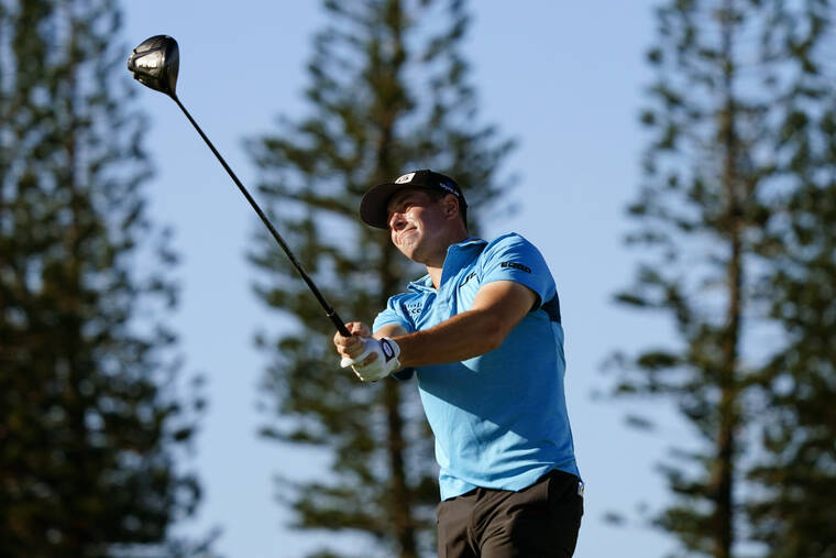 ASSOCIATED PRESS
                                Viktor Hovland, of Norway, hits from the 13th tee during the Tournament of Champions pro-am team play golf event today at Kapalua Plantation Course in Kapalua.