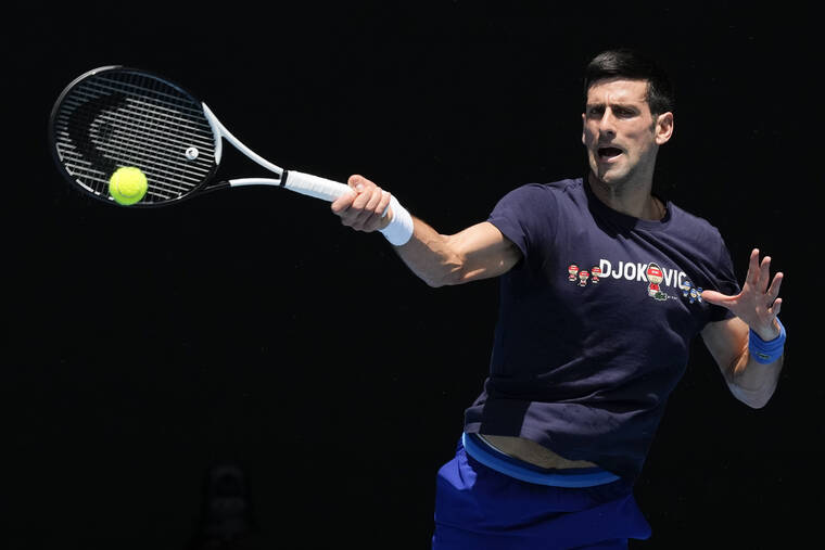 ASSOCIATED PRESS
                                Defending men’s champion Serbia’s Novak Djokovic practiced on Rod Laver Arena ahead of the Australian Open tennis championship in Melbourne, Australia, today.