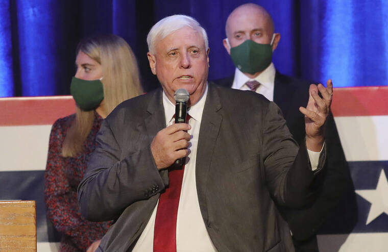 ASSOCIATED PRESS / 2020
                                West Virginia Gov. Jim Justice celebrates his reelection at The Greenbrier Resort in White Sulphur Springs, West Viriginia. West Virginia Gov. Jim Justice tested positive for COVID-19 on Tuesday, Jan. 11, his office announced. Justice had a sudden onset of symptoms, then was administered a PCR test that was positive for the coronavirus.