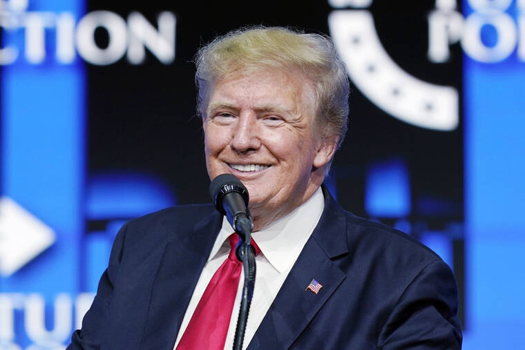 ASSOCIATED PRESS
                                Former President Donald Trump smiled as he paused while speaking to supporters at a Turning Point Action gathering in Phoenix, July 24. Trump is slamming politicians who refuse to say whether they’ve received COVID-19 booster shots, calling them “gutless.”
