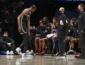 ASSOCIATED PRESS
                                Brooklyn Nets forward Kevin Durant (7) leaves the game after injuring his knee during the first half of an NBA basketball game against the New Orleans Pelicans Saturday in New York.