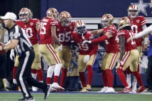 ASSOCIATED PRESS
                                San Francisco 49ers’ Jauan Jennings (15), George Kittle (85), Kyle Juszczyk (44), Brandon Aiyuk (11) and Jimmy Garoppolo, right, celebrate with Deebo Samuel (19) after his touchdown catch in the second half of an NFL wild-card playoff football game in Arlington, Texas, today.